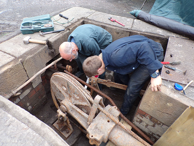 Julian & Charlie removing a cast iron pillar during reassembly of the jugger-guides